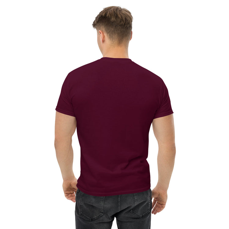 Back view of man wearing maroon classic tee shirt with short sleeves and black jeans