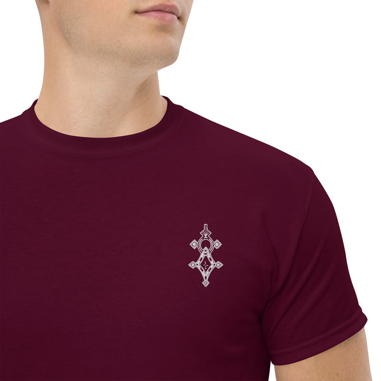 Men wearing a burgundy classic tee with a small geometric design on the chest