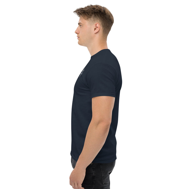 Side view of man wearing navy blue classic tee made of 100% cotton for structured, sharp-edged look