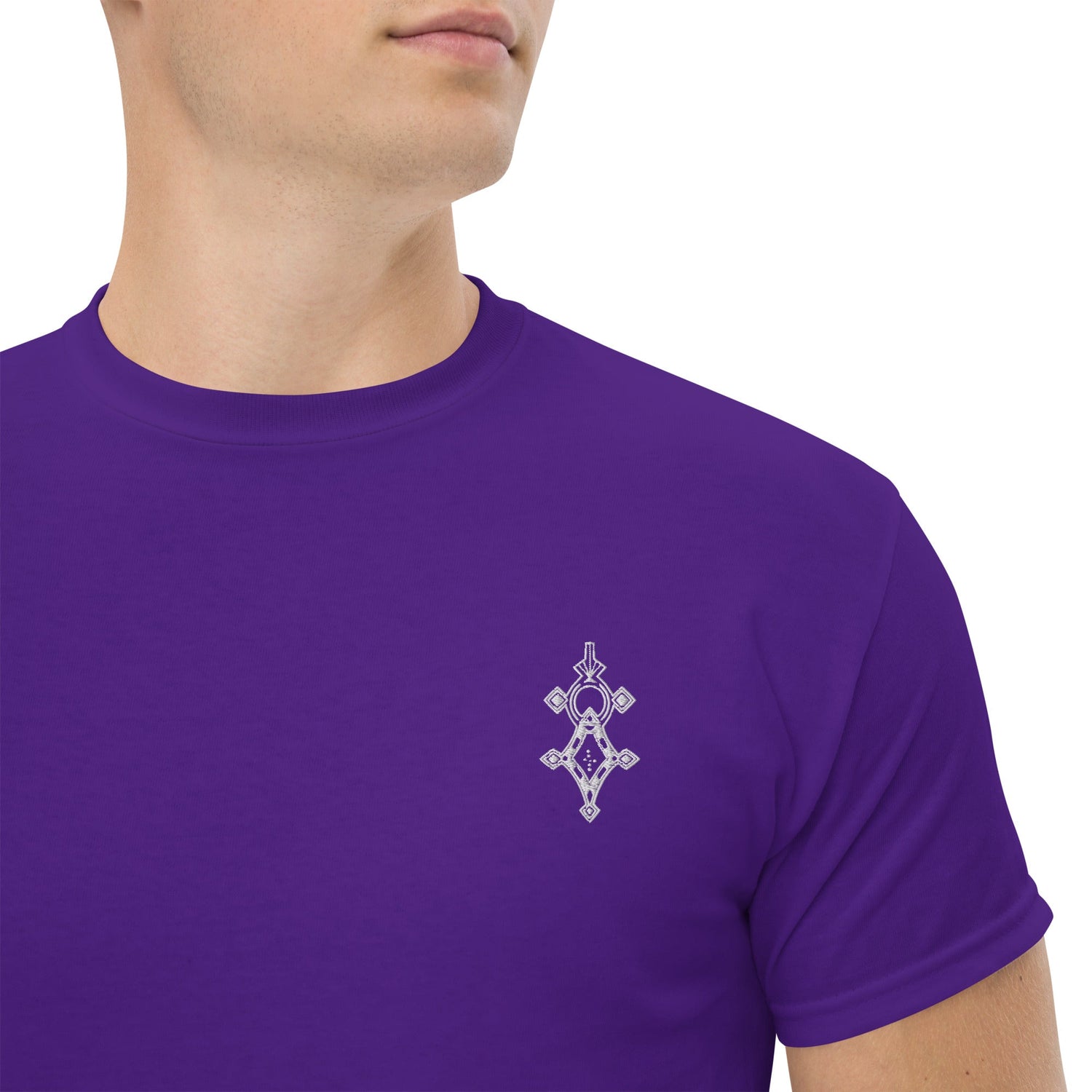 Men wearing purple classic tee with small geometric design on chest