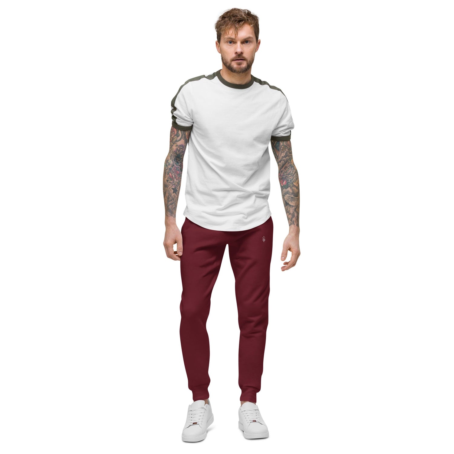 Man wearing maroon men fleece sweatpants with white sneakers and white t-shirt