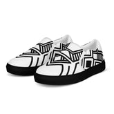 Women’s slip-on canvas shoes with black geometric design and black rubber sole