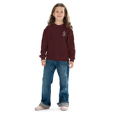 Youth crewneck sweatshirt in burgundy worn by child with jeans and sneakers