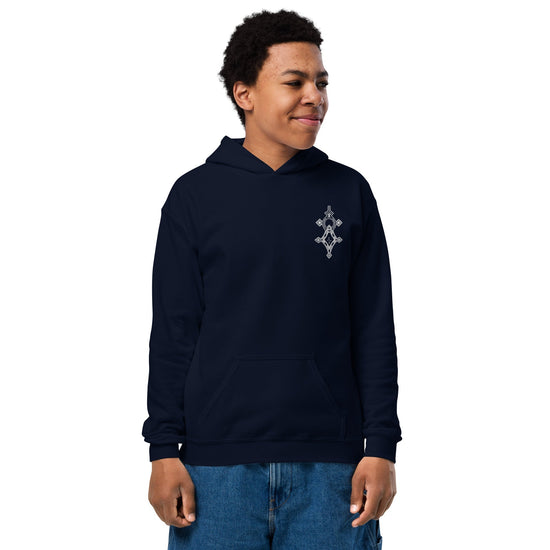 Youth heavy blend hoodie in navy blue with front pouch pocket and no drawcords, worn by a child.