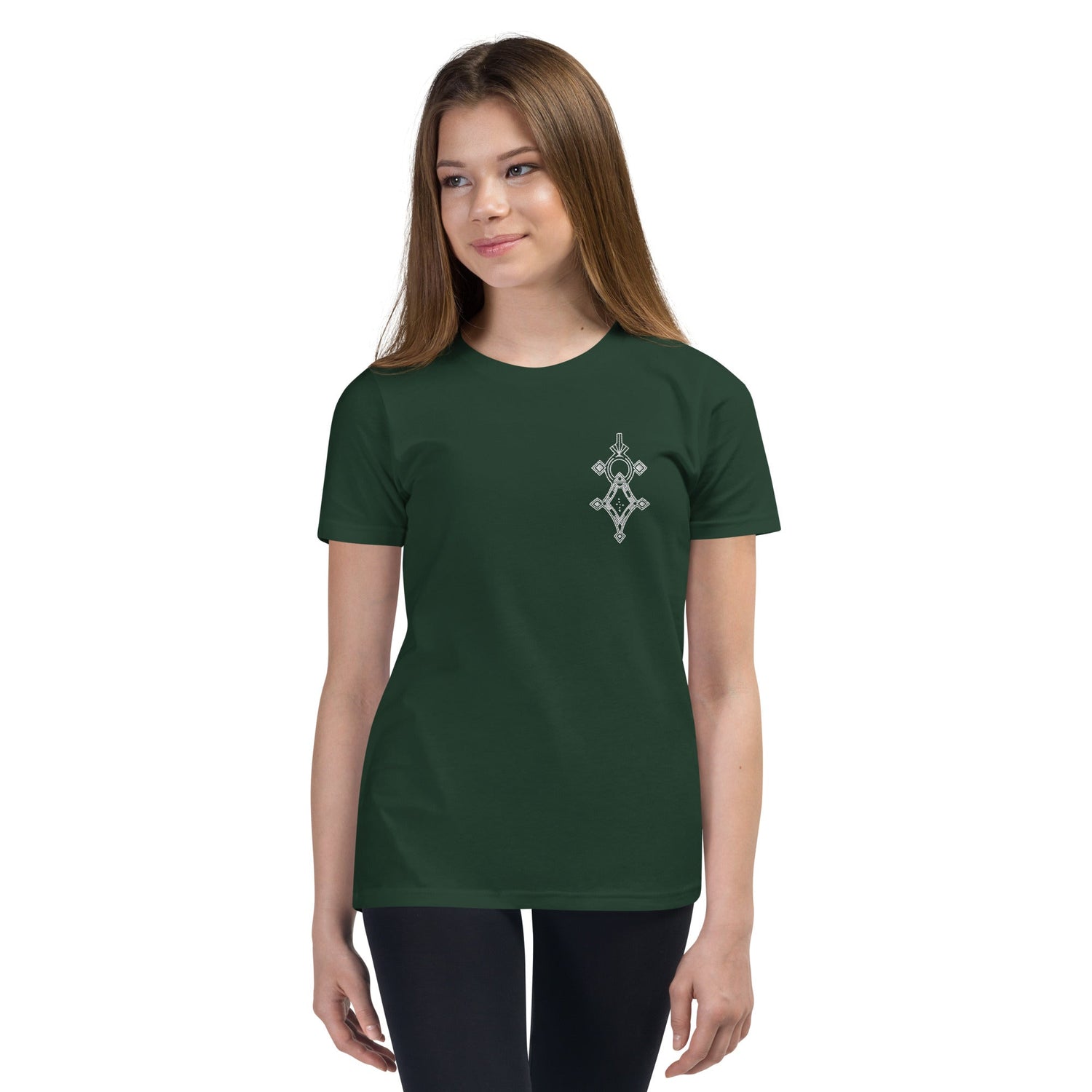 Youth short sleeve t-shirt in dark green with a small front print, worn by a young girl with relaxed unisex fit.